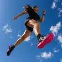 Runner in mid-stride against a blue sky with SYLACORE Sport Running insoles