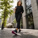 Woman walking through the city in trainers with SYLACORE Casual Regular insoles