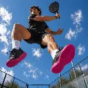 Padel player jumping on court with SYLACORE Sport Racket & Golf insoles